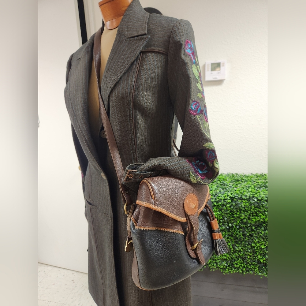 Dooney & Bourke Teton vintage RARE Drawstring saddle tasseled Pebbled crossbody.